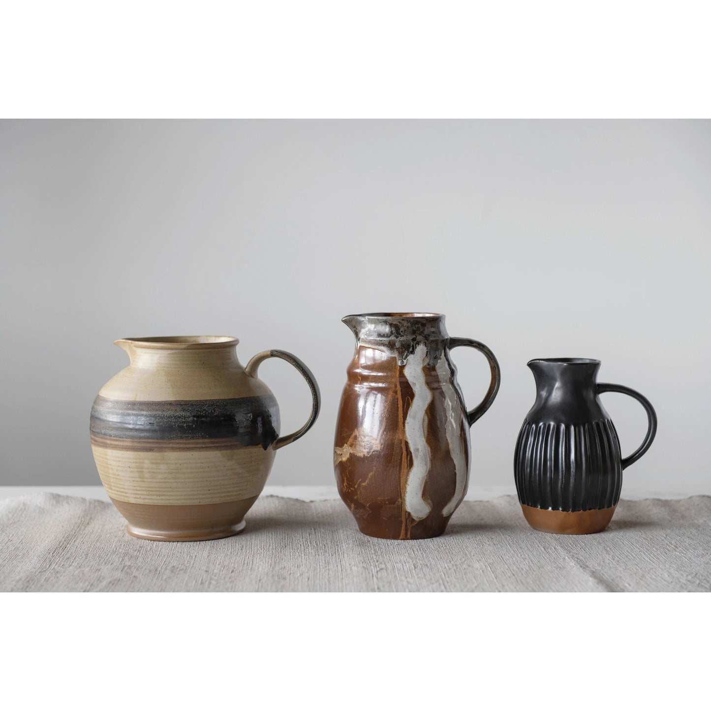 Stoneware pitcher, matte black reactive glaze